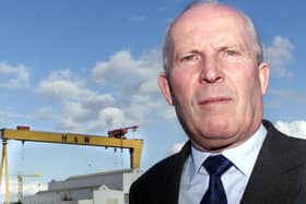 Cllr Jim Rodgers in the shadows of the Harland and Wolff cranes.
Picture by Brian Little