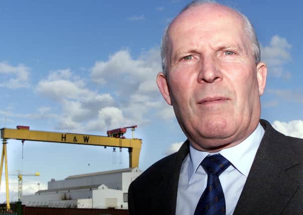 Cllr Jim Rodgers in the shadows of the Harland and Wolff cranes.
Picture by Brian Little