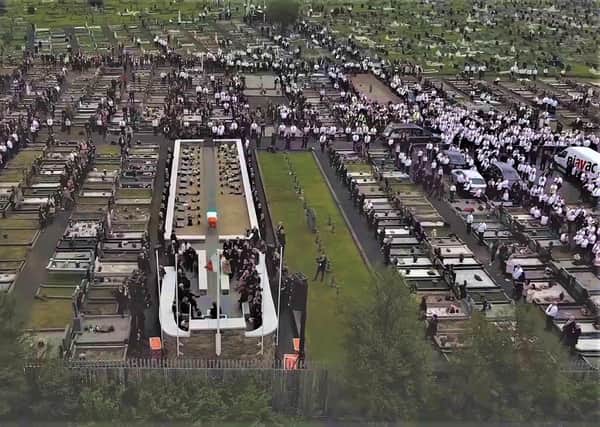 Aerial view of mourners in Milltown Cemetery