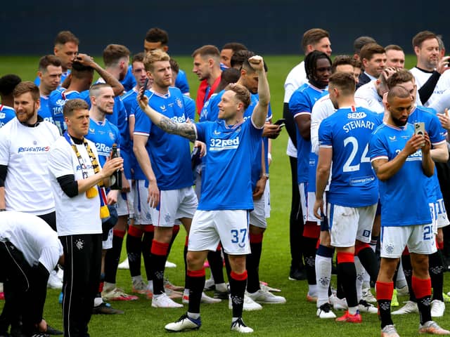 Rangers players celebrate on the pitch after winning the Scottish Premiership; no criminality was found by police