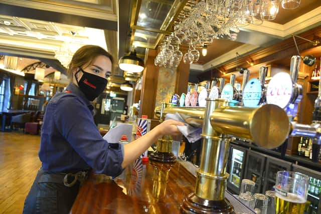 Stormont ministers approved relaxing lockdown rules in Northern Ireland, meaning hospitality can operate indoors from Monday 24 May. Staff at The Lansdowne Hotel getting ready for Monday's opening.
Picture By: Arthur Allison/Pacemaker.