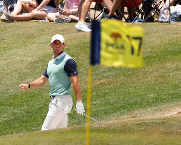 Rory McIlroy watches his shot on the 17th green