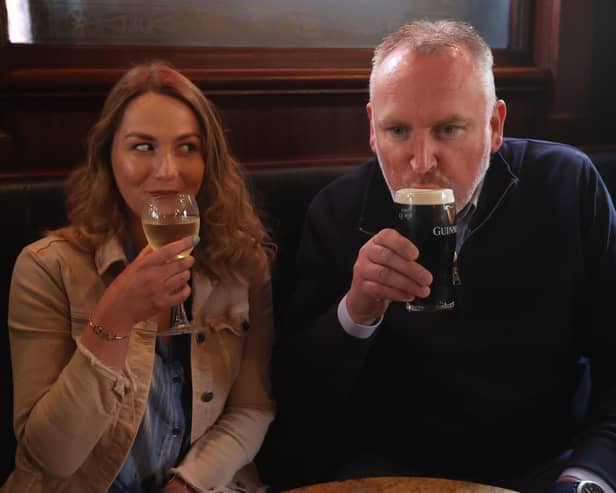 Natalie Knox and Campbell Brady enjoy a drink at The Garrick Bar in Belfast, after the latest easing of the Covid-19 rules in Northern Ireland .Photo: Liam McBurney/PA Wire
