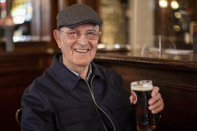 Tommy Brady, 78, enjoying his first pint of Smithwick's Ale since Christmas Eve at The Garrick Bar in Belfast .Photo: Liam McBurney/PA Wire