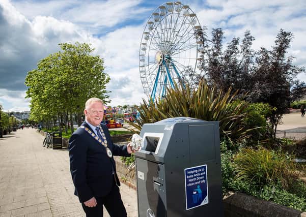 Mayor Trevor Cummings with one of the new solar-powered compacting bins in Bangor. (Image: Graham Baalham-Curry)