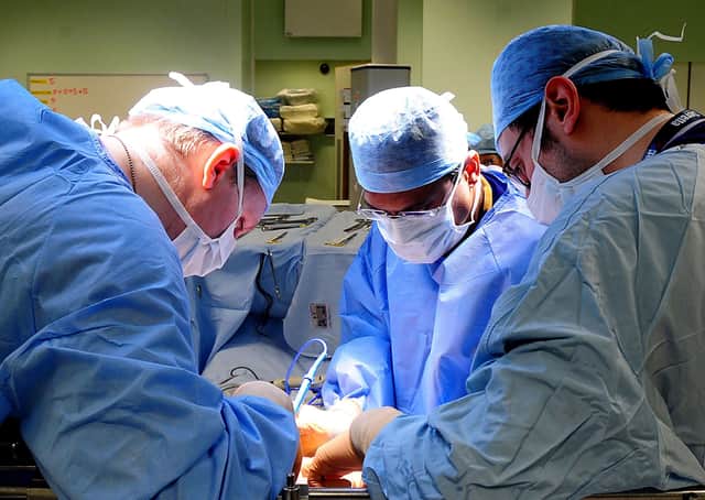 A surgical team. Photo: Rui Vieira/PA Wire