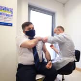 Health Minister Robin Swann pictured receiving his first dose of a Covid-19 vaccine at the end March.