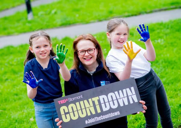 RSPB NI’s Sara McCracken is photographed with her daughters Maisie and Isobel as they 'canvas' for nature by illustrating a nature rich and climate safe future they want to see for Northern Ireland, as part of the charity’s Revive Our World campaign