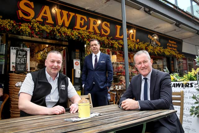 Finance Minister, Conor Murphy picture with Glyn Roberts Chief Executive of Retail NI and  Kieran Sloan, Managing Director of Sawers in Belfast which will benefit from a £10,000 top up grant