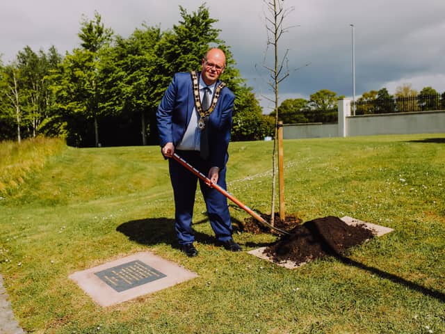 Mayor Cllr Jim Montgomery plants Covid memorials.