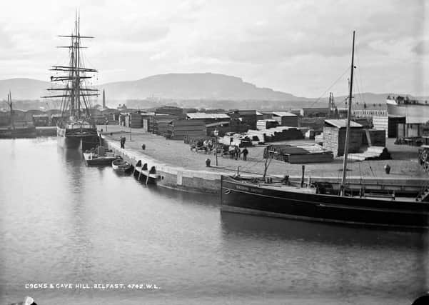 The docks in Belfast with the Bangor Castle tied to the quay and beautifully stacked timbers all around. The queue of horse carts with sacks of coal. NLI Ref: L_ROY_04742. Picture: National Library of Ireland