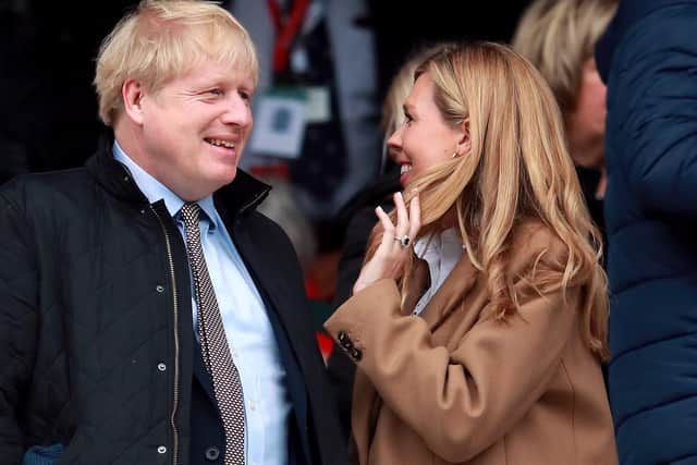 File photo dated 07/03/20 of Prime Minister Boris Johnson and partner Carrie Symonds at Twickenham Stadium, London
