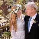 Handout photo of Prime Minister Boris Johnson and Carrie Johnson in the garden of 10 Downing Street after their wedding on Saturday