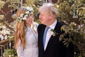 Handout photo of Prime Minister Boris Johnson and Carrie Johnson in the garden of 10 Downing Street after their wedding on Saturday