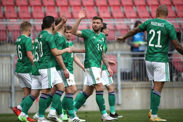 Gavin Whyte celebrates with his team-mates after scoring against Malta