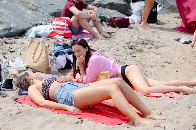 Beachgoers pictured enjoying the sun at Helen's Bay on Bank Holiday Monday.

Picture: Philip Magowan / PressEye