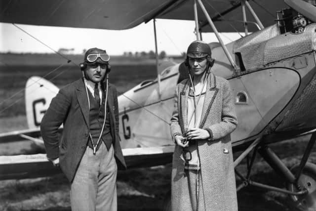 20th June 1928:  American aviator Amelia Earhart (1898 - 1937), noted for her flights across the Atlantic and Pacific oceans, with her pilot Captain A N White at Northolt, London.  (Photo by J. Gaiger/Topical Press Agency/Getty Images)