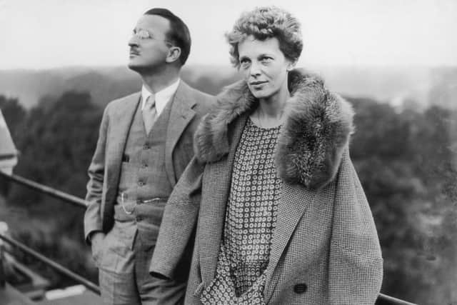 American aviatrix Amelia Earhart (1897 - 1937) on the roof of the Hyde Park Hotel in London, with Captain Hilton H Railey, 20th June 1928. At Railey's suggestion, Earhart had just completed a successful transatlantic flight. (Photo by Hulton Archive/Getty Images)
