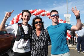 Joshua Eastwood finishes his 31st marathon in May. He's joined by his mum Gail and twin brother Jacob. 
Photograph by Declan Roughan