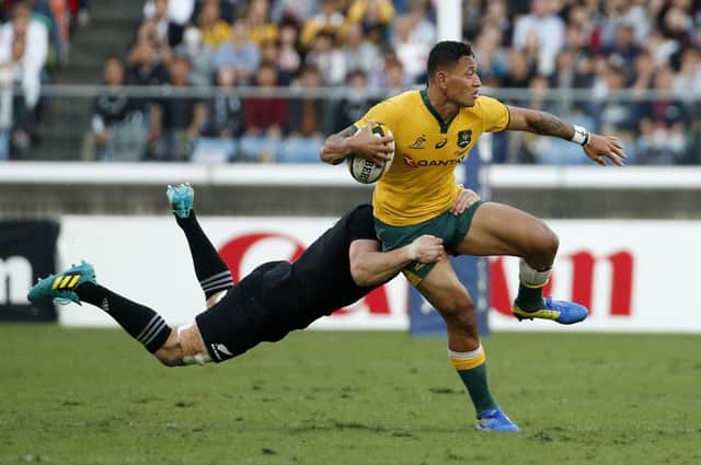The Australia rugby player Israel Folau, seen above being tackled in a game in 2018, was, Samuel Morrison writes, "effectively driven out of his sport because he dared to quote one of the texts I have cited in this article". (AP Photo/Shuji Kajiyama)
