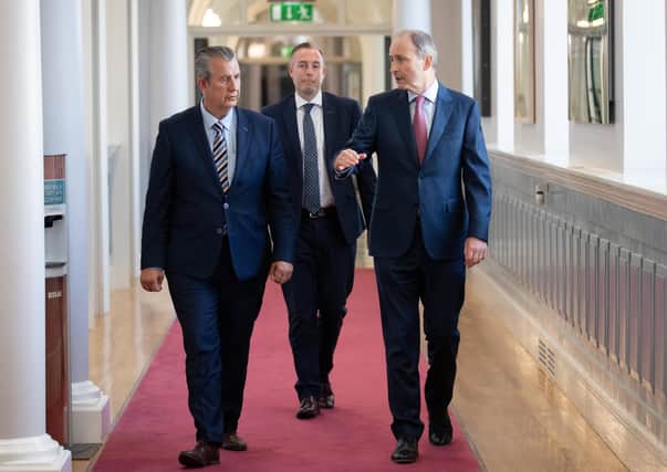Taoiseach Micheal Martin (right) meeting with DUP Leader Edwin Poots (left) and DUP MLA Paul Given at Government Buildings, Dublin. Julien Behal Photography