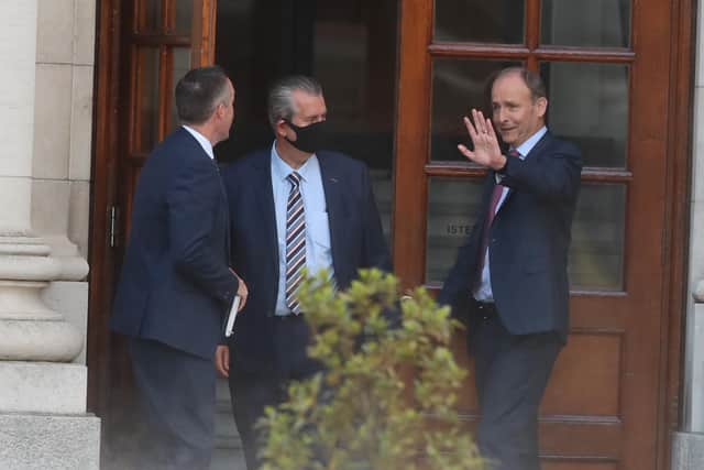 Taoiseach Micheal Martin waves goodbye to DUP leader Edwin Poots and MLA Paul Givan, after their meeting at Government Buildings, Dublin. Photo: Brian Lawless/PA Wire