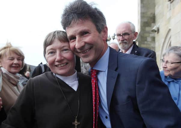 After making her first profession of vows in St Peter's Cathedral, west Belfast Sr Martina is greeted by the BBC Political Editor  Mark Devonport. Picture by Ann McManus
