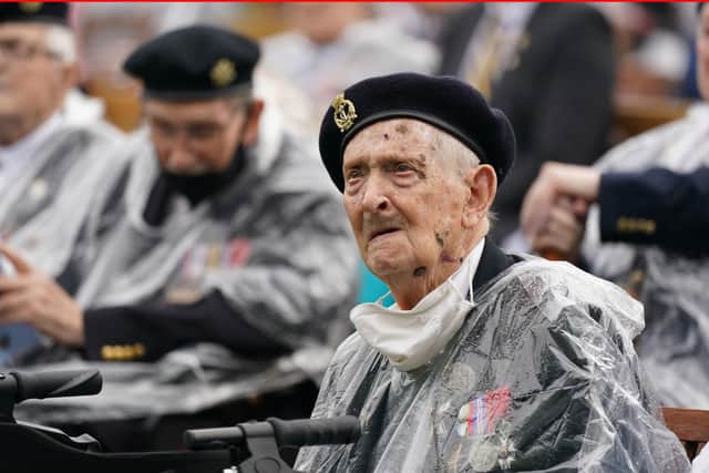 Veterans watch the official opening of the British Normandy Memorial in France via a live feed during a ceremony at the National Memorial Arboretum in Alrewas, Staffordshire. Photo: Jacob King/PA Wire