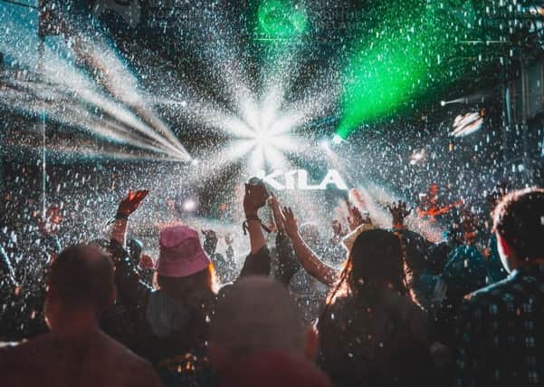 Crowds enjoy the atmosphere outdoors despite the rain at the Stendhal Festival in Co Londonderry in 2019