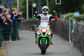 Michael Dunlop celebrates victory in the 2011 Superstock TT on the MD Racing/Street Sweep Kawasaki ZX-10.