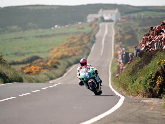 Can you name this famous Isle of Man TT rider and the year and corner where this picture was taken?