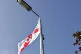 Calls for flags to be removed from town centres.