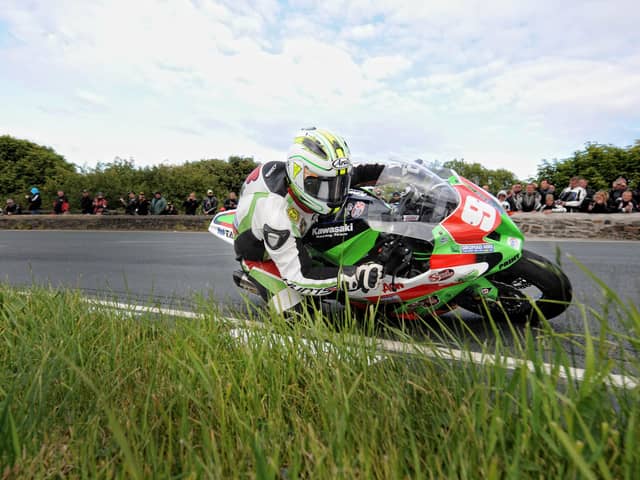 Michael Dunlop rounds the Gooseneck on his way to winning the 2011 Superstock race at the Isle of Man TT.