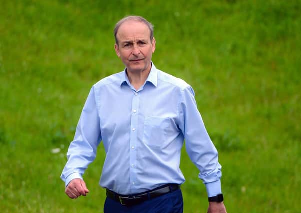 Taoiseach Micheal Martin seen in relaxed form as he took an early morning stroll at Lough Erne Resort ahead of the British-Irish Council summit on Friday.  Picture: McGrade/Pacemaker Press
