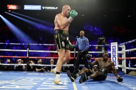 Tyson Fury knocks down Deontay Wilder in the fifth round during their Heavyweight bout in Las Vegas on February 22, 2020