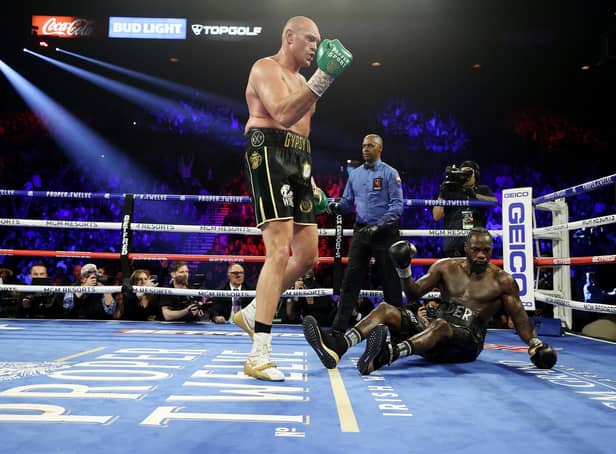 Tyson Fury knocks down Deontay Wilder in the fifth round during their Heavyweight bout in Las Vegas on February 22, 2020