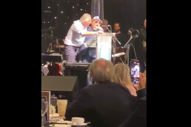 Van ordered Ian to join him on the stage, shouting "Come on up Junior."  Apparently Ian Paisley Junior doesn’t like being called 'Junior'