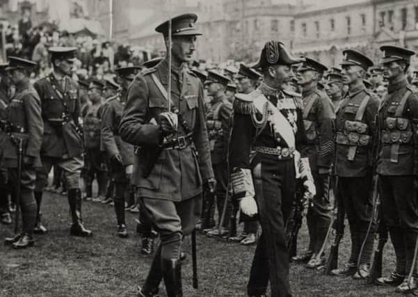 King George V inspects a guard of honour during his short visit to Belfast on June 22 1921