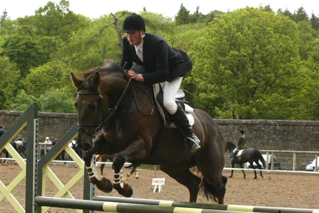 Lionel Johnston from Maguiresbridge  on " Irish Border Queen" competing in the jumping classes at Enniskillen Horse and Pony Show.