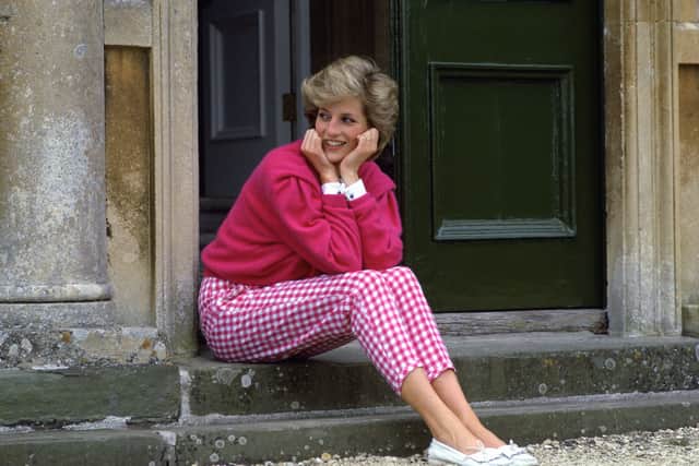 Diana, Princess of Wales, sitting on ohe steps outside her country home, Highgrove