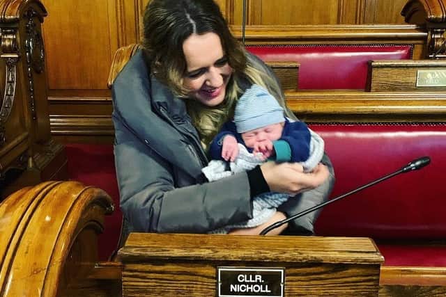 Kate in the chamber at Belfast City Council with her son Cian