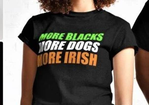 Models for the retailer Redbubble posing with a ‘More Blacks, More Dogs, More Irish’ t-shirt, popularly worn by self-described anti-racists; Ruth Dudley Edwards however questions whether the slogan which the t-shirt is denouncing (No Blacks, No Dogs, No Irish) ever in fact existed in real life