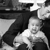 File photo dated 22/12/1982 of Prince Charles cradling his son Prince William at Kensington Palace, London. Issue date: Monday June 21, 2021.