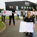 Cormac Diamond, managing director of Bloc Blinds, with staff and the Red Dot Award for product design