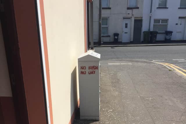 Racist and homophobis slogan appears on junction box in a Lurgan street.