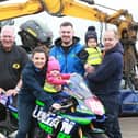 Armoy Clerk of the Course, Bill Kennedy MBE and road racer Neil Kernohan pictured with Martin and Nicole Laverty, Euro Autospares Limited - sponsors of the Open Superbike race - and their children, Clodagh and Caidan.