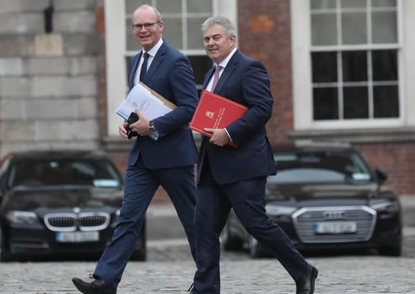 NI Secretary Brandon Lewis (right) and Irish Foreign Minister Simon Coveney after a meeting of the British-Irish Intergovernmental Conference in Dublin. Photo: Julien Behal Photography/PA Wire