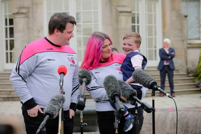 Daithi MacGabhann, with father Mairtin and his partner Seph Ni Mheallain, at Stormont Castle. The father of the four-year-old boy who needs a new heart has hailed an "emotional day" after Stormont leaders agreed to progress a long-awaited law on opt-out organ donation in Northern Ireland.