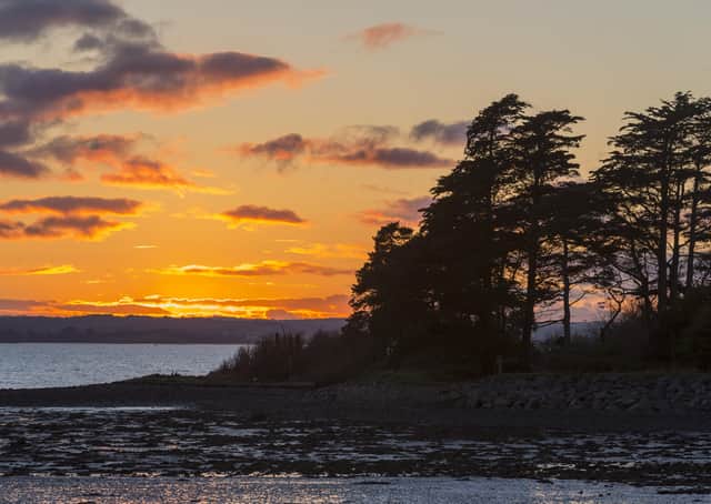 The sun sets on the shore of Strangford Lough, at Mount Stewart, County Down. The days are now getting shorter but in Northern Ireland the days are so long that it will be autumn before it begins to seem dark