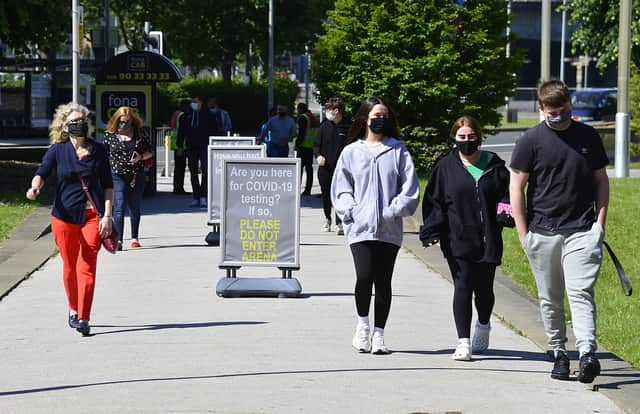 People arrive at the SSE Arena on Sunday with walk-in vaccinations starting for the first time for those aged 18 and over.Picture By: Arthur Allison/Pacemaker.